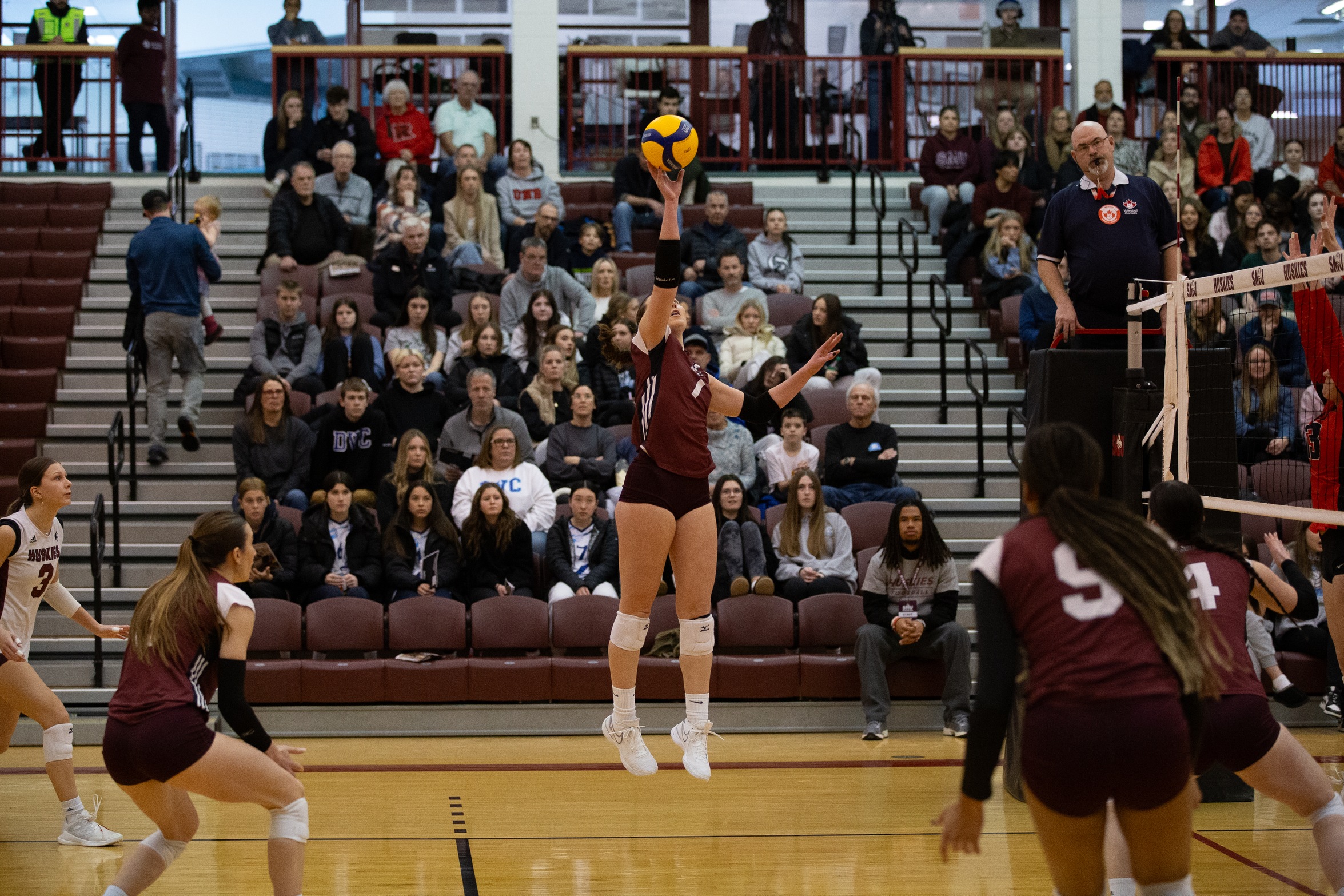 REDS come from behind to defeat Huskies in five sets